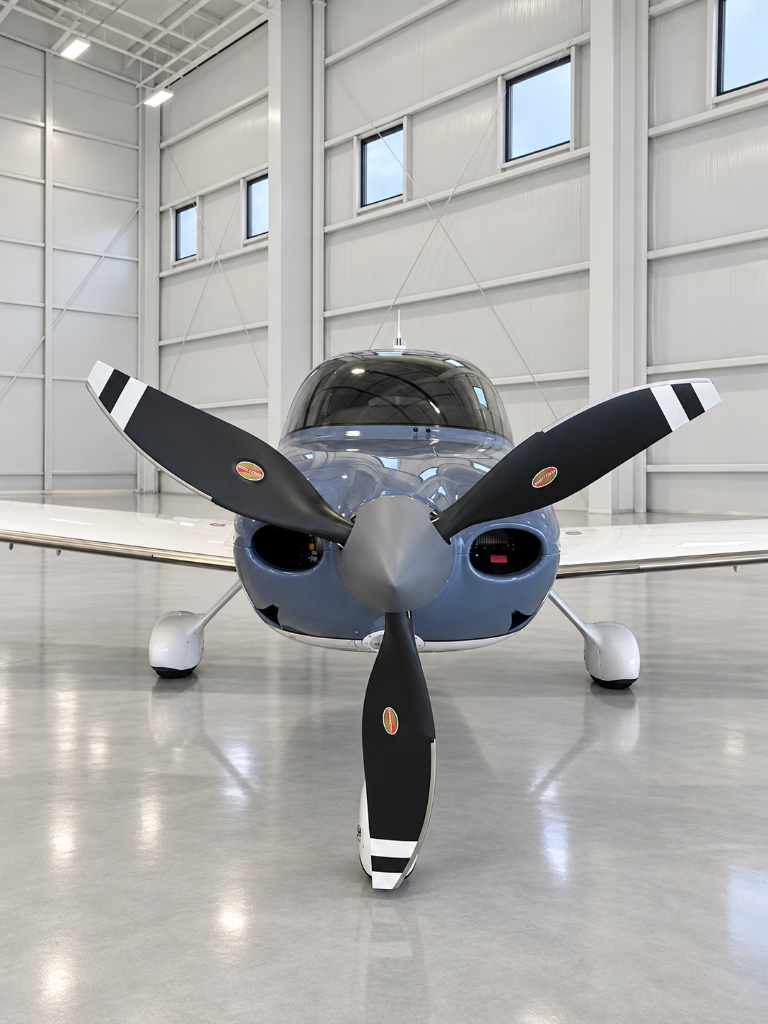 Aircraft positioned inside a clean professional hangar